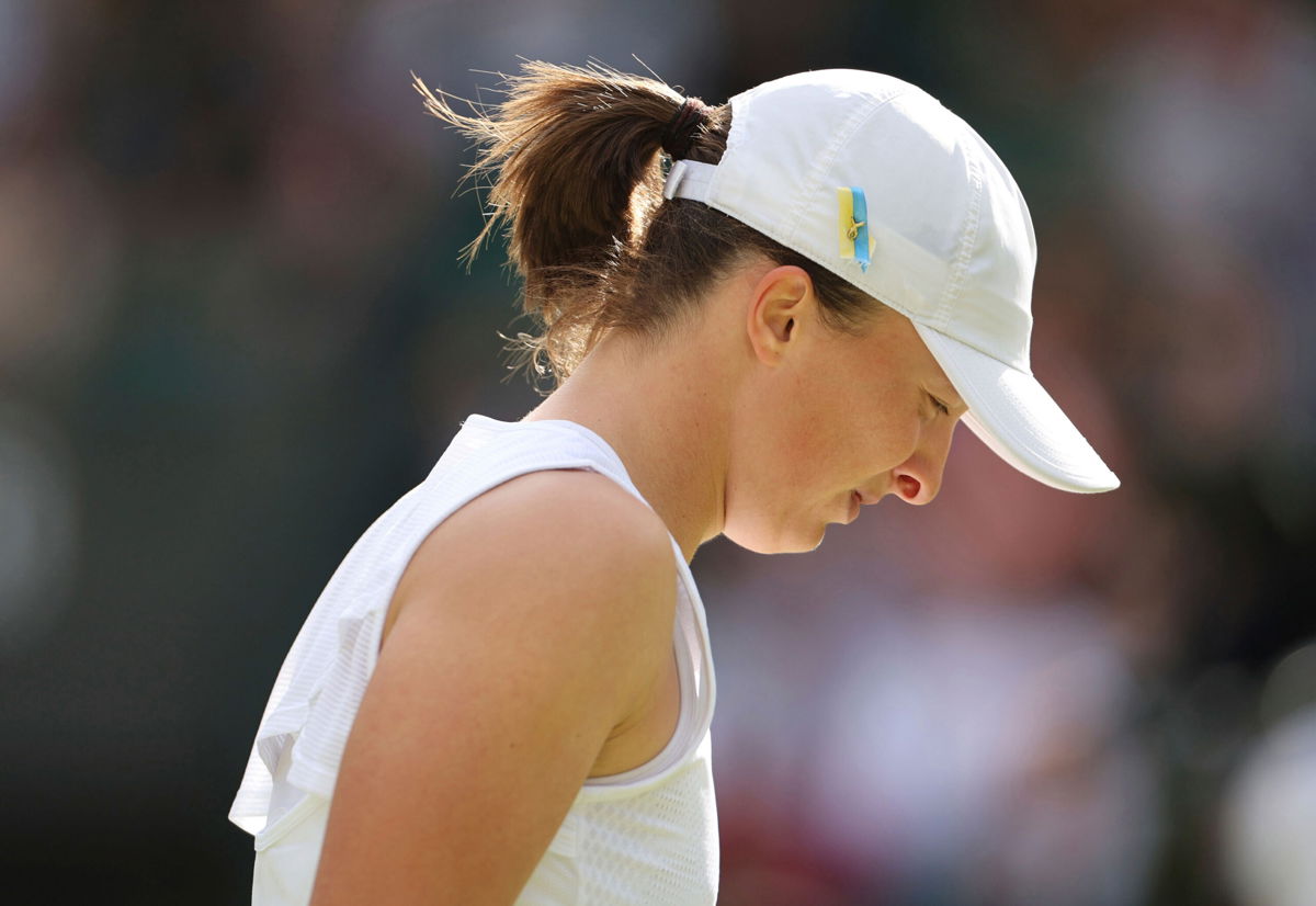 <i>Takuya Matsumoto/The Yomiuri Shimbun/AP</i><br/>Iga Swiatek of Poland looks disappointed at losing the game against Alizé Cornet of France in the ladies' singles third-round match at Wimbledon.