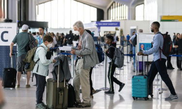 Travelers line up to check in at Newark Liberty International Airport on July 1. Newark is the world's No. 2 airport for cancellations this summer.