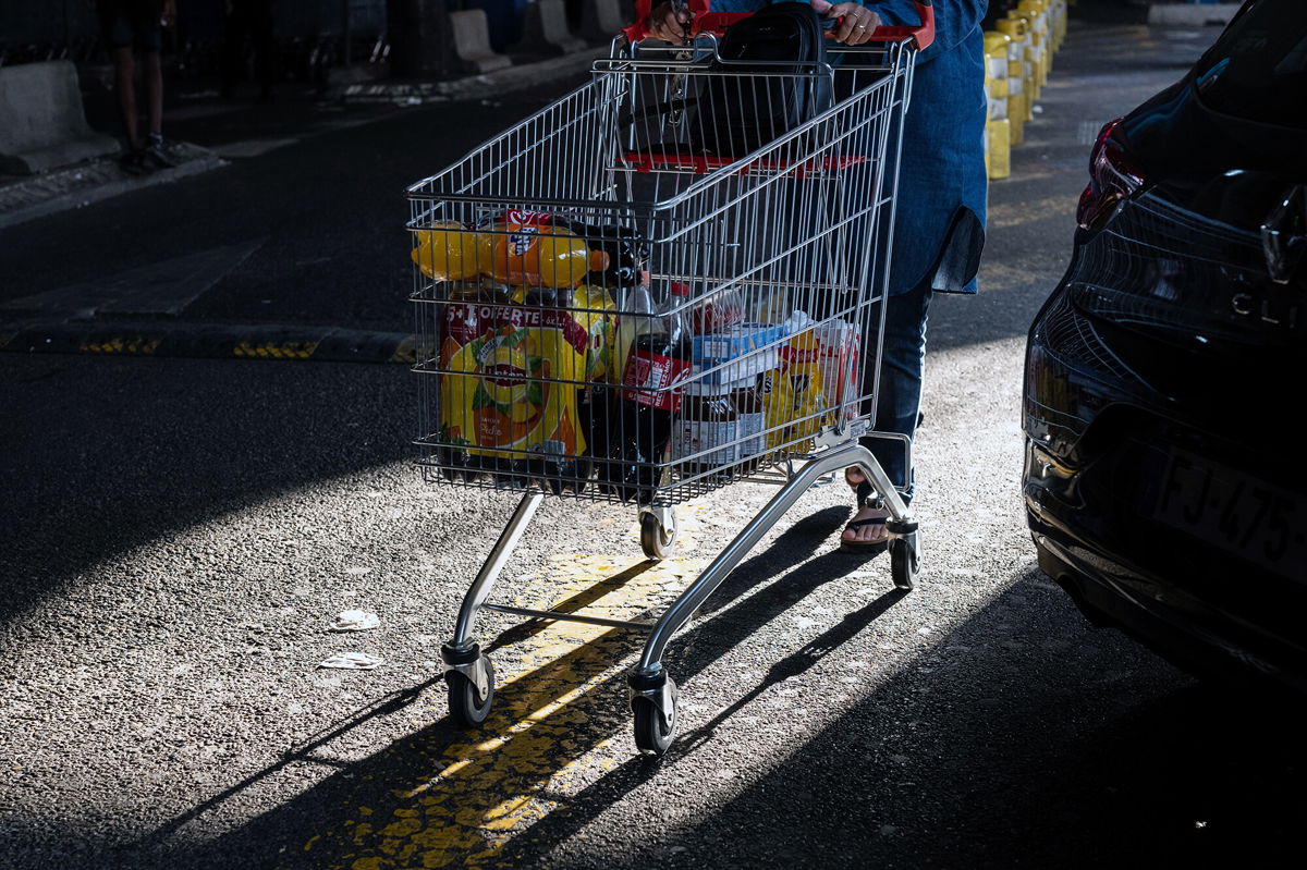 <i>Jeremy Sukur/Bloomberg/Getty Images</i><br/>A customer pushes a shopping cart in the parking lot of the Carrefour SA hypermarket in Marseille