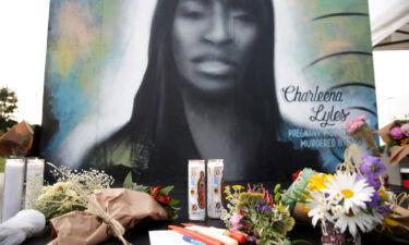 Flowers and candles are pictured at a makeshift memorial during a vigil on the third anniversary of the death of Charleena Lyles who was shot and killed by Seattle police.