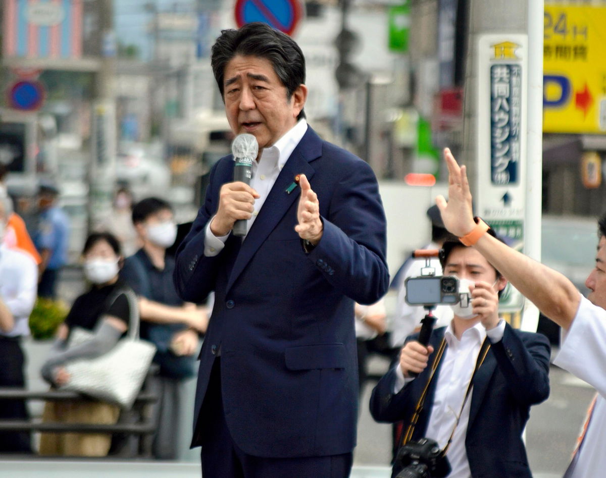 <i>Kazuhiko Hirano/AP</i><br/>Japanese former Shinzo Abe speaks for his party member candidate of the House of Councillors Election near Yamato Saidaiji Station in Nara Prefecture on July 8