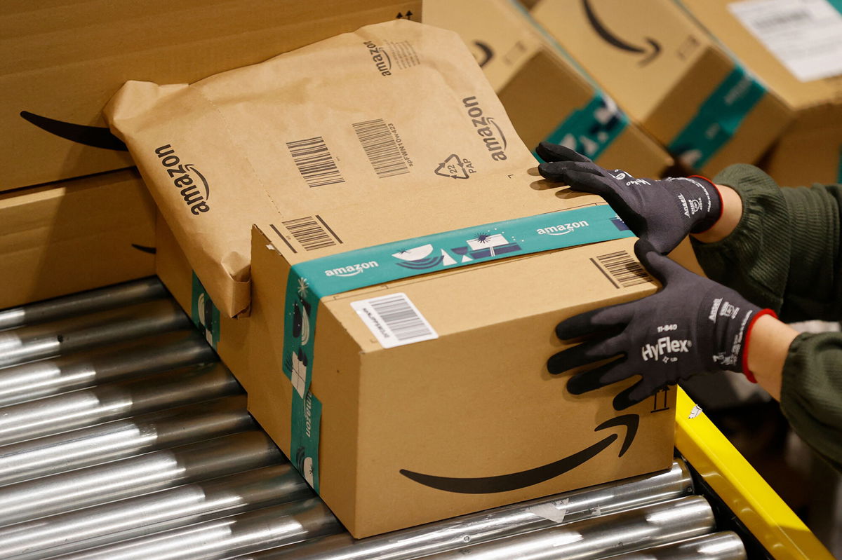 <i>Thomas Samson/AFP/Getty Images</i><br/>An employee handles packages at the Amazon's center of Bretigny-sur-Orge