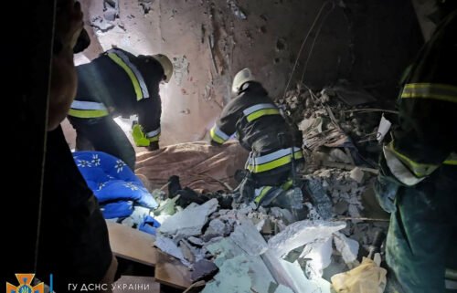 Rescue workers at the scene of the missile strike