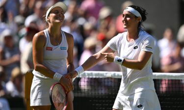 Ons Jabeur (right) and Tajana Maria take in the applause after their Wimbledon semifinal.