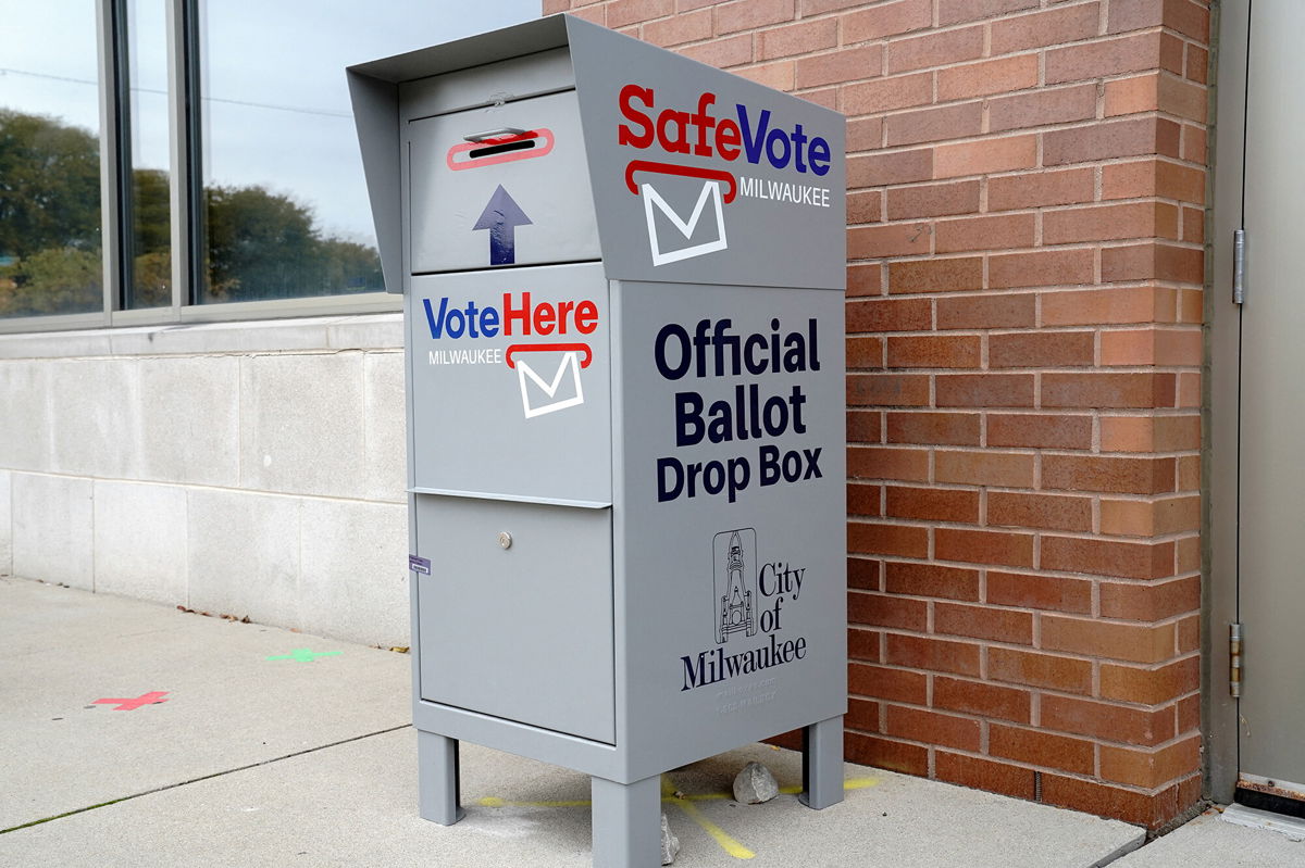 <i>Bing Guan/Reuters</i><br/>An official drop box for mail-in ballots is seen outside a polling site in Milwaukee