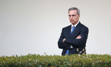 White House counsel Pat Cipollone listens as President Donald Trump speaks during a coronavirus task force briefing in the Rose Garden of the White House