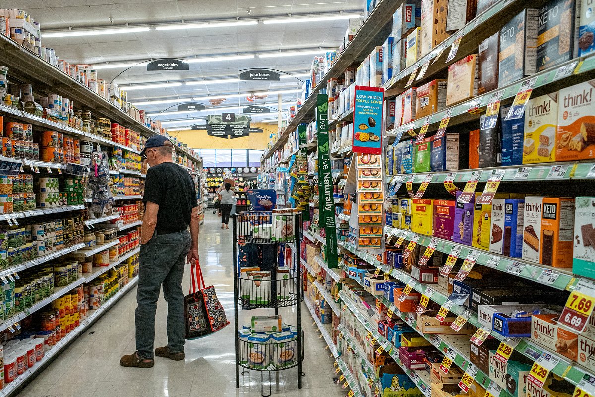 <i>Brandon Bell/Getty Images</i><br/>A customer shops in a Kroger grocery store on July 15 in Houston