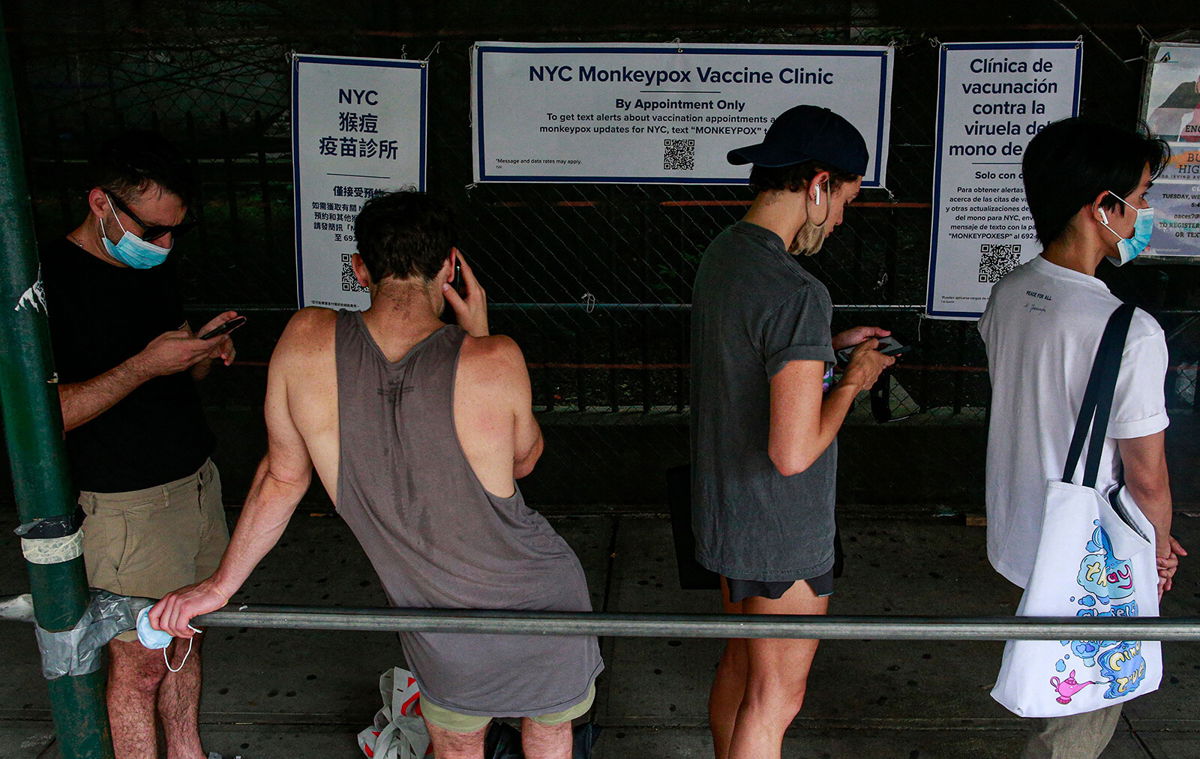 <i>Kena Betancur/AFP/Getty Images</i><br/>People wait in line to receive the Monkeypox vaccine before the opening of a new mass vaccination site at the Bushwick Education Campus in Brooklyn on July 17 in New York City.