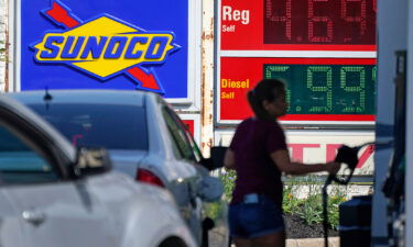 Economists polled by Refinitiv are forecasting that prices shot up 8.8% in the 12 months to June as energy costs leaped and pictured a woman pumps gas at a Sunoco mini-mart in Independence