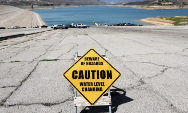 A caution sign is posted at the Castaic Lake reservoir in Los Angeles County on May 3