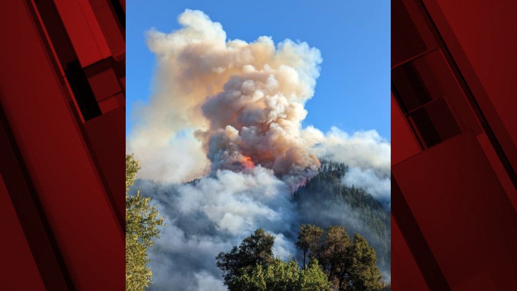 Smoke billows from the Rum Creek Fire, which exploded in size Friday