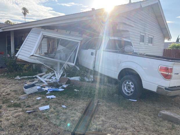 <i>Sacramento Fire Department/KOVR</i><br/>A man was seriously hurt Thursday evening after a suspect fleeing police crashed a pickup truck into his home.