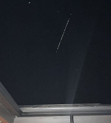 The row of Starlink satellites were captured on camera over Bend around 10 p.m. Saturday