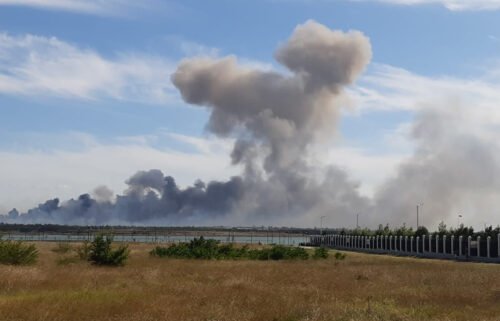 Smoke rises after explosions were heard from the direction of a Russian military base in Crimea on August 9.
