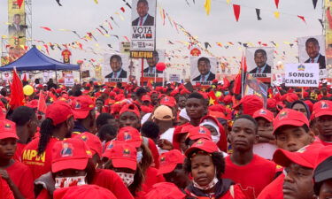 Supporters of Angola's President and leader of the ruling MPLA Joao Lourenco attend their party's final rally in Camama