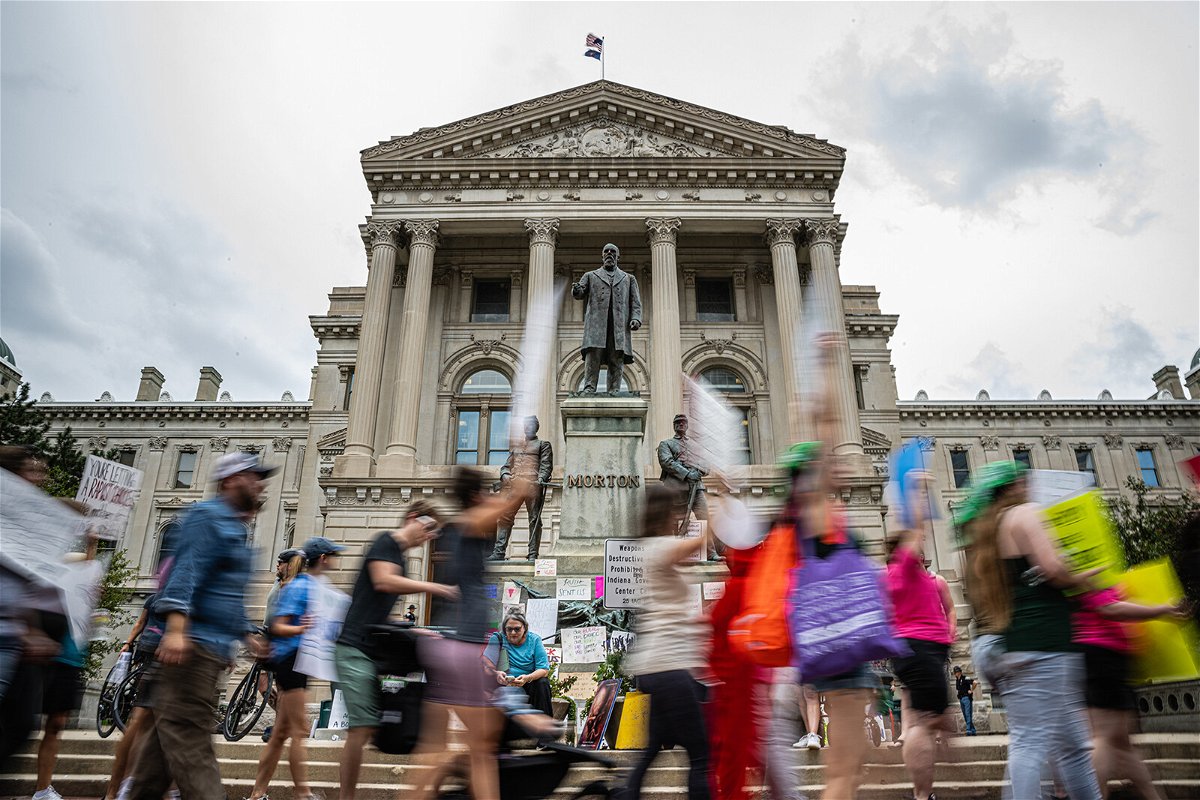 <i>Jon Cherry/Getty Images</i><br/>Abortion rights protesters march outside the Indiana State Capitol building. Near-total abortion ban in Indiana passed the GOP-controlled Senate and now heads to the State House.