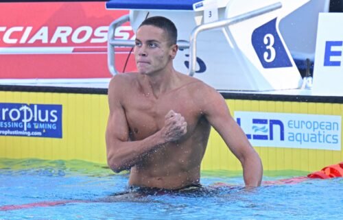 Popovici thumps his chest after setting a world record in the 100m freestyle.