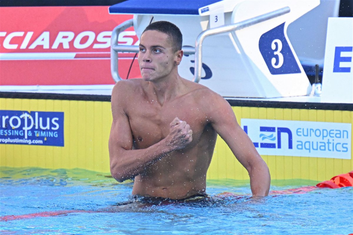 <i>ALBERTO PIZZOLI/AFP/Getty Images</i><br/>Popovici thumps his chest after setting a world record in the 100m freestyle.