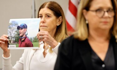 Linda Beigel Schulman holds a photo of her son