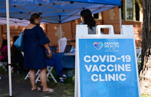 The US is on a Covid plateau. Pictured is a Covid-19 vaccine clinic in Denver