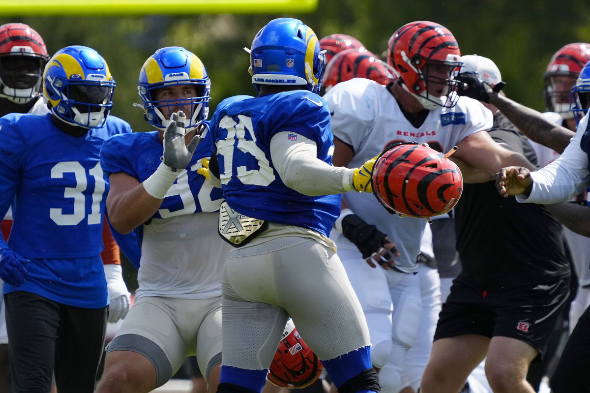 <i>Sam Greene/AP</i><br/>Los Angeles Rams defensive lineman Aaron Donald (99) swings a helmet during a joint practice between the Bengals and the Rams in Cincinnati.