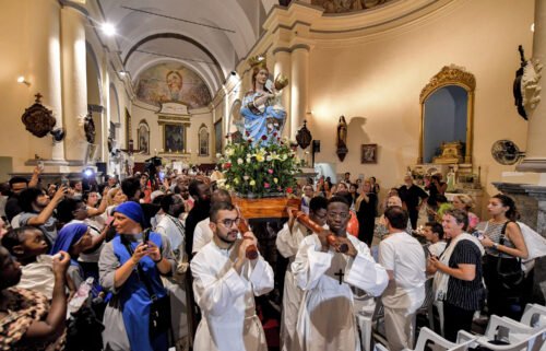 Worshippers carry the shrine of the Madonna of Trapani during the procession at the Saint-Augustin and Saint-Fidèle church in Tunisia on August 15.