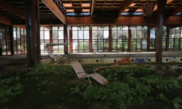 A lawn chair sits as nature takes over the indoor pool area of Grossinger's Catskill Resort Hotel on July 5
