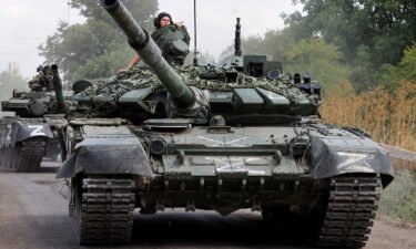 Service members of pro-Russian troops drive tanks in the course of Ukraine-Russia conflict near the settlement of Olenivka in the Donetsk region
