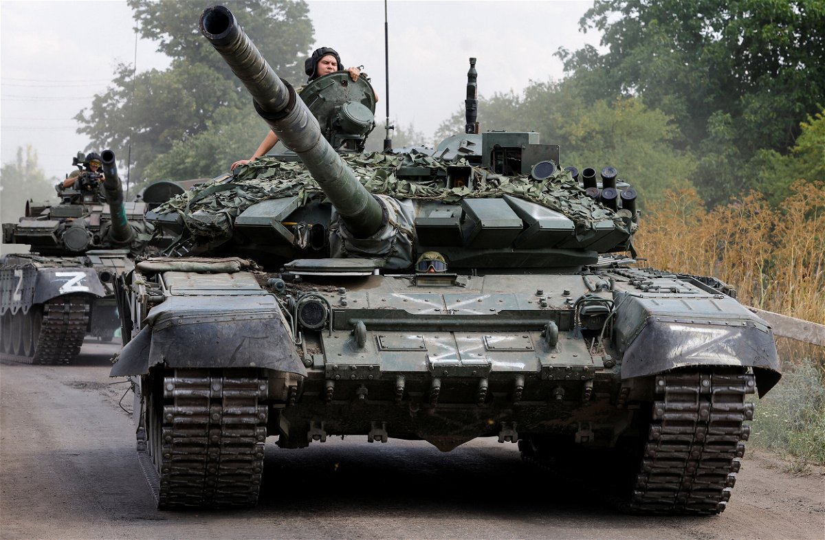 <i>Alexander Ermochenko/Reuters</i><br/>Service members of pro-Russian troops drive tanks in the course of Ukraine-Russia conflict near the settlement of Olenivka in the Donetsk region