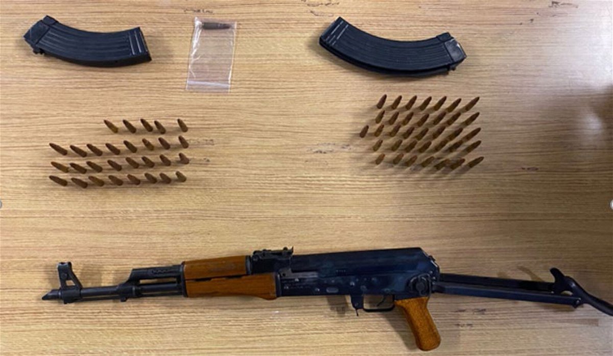 <i>From DOJ</i><br/>Law enforcement found a suitcase containing a loaded AK-47-style rifle