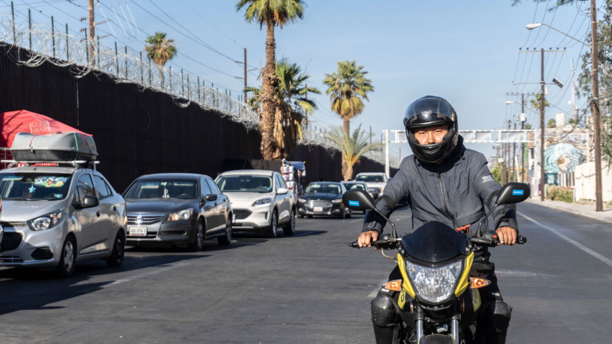 <i>CNN</i><br/>Wang Qun drives his motorcycle in Mexicali.