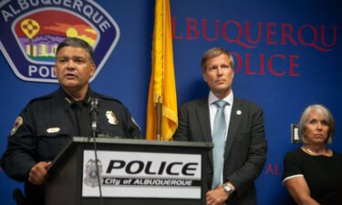 Albuquerque Police Chief Harold Medina (left) was joined by Mayor Tim Keller and Gov. Michelle Lujan Grisham in announcing the suspect's arrest in a news conference on August 9.