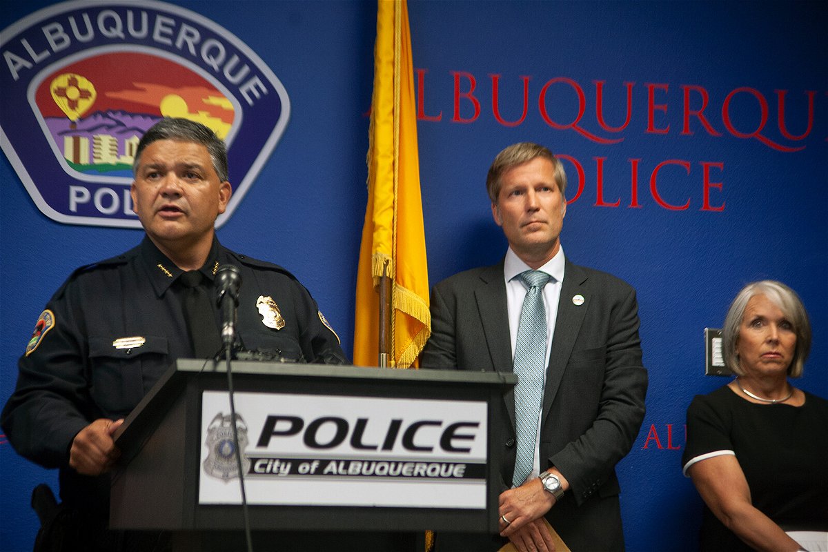 <i>Adolphe Pierre-Louis/Albuquerque Journal/ZUMA</i><br/>Albuquerque Police Chief Harold Medina (left) was joined by Mayor Tim Keller and Gov. Michelle Lujan Grisham in announcing the suspect's arrest in a news conference on August 9.