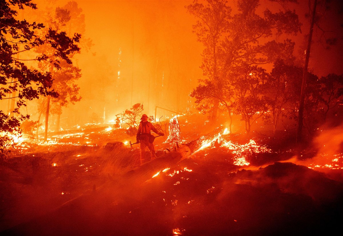 <i>Josh Edelson/AFP/Getty Images</i><br/>A firefighter battles flames during the Creek Fire in Madera County