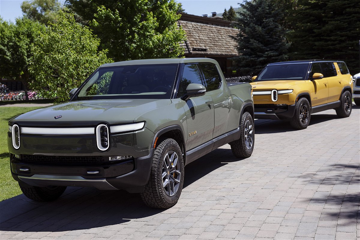 <i>Kevin Dietsch/Getty Images</i><br/>A Rivian R1T Truck and R1S SUV is parked outside the Allen & Company Sun Valley Conference on July 8 in Sun Valley
