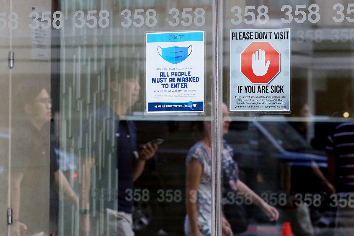 <i>John Smith/VIEWpress/Corbis News/Getty Images</i><br/>Signage requesting mask usage and Covid-19 safety precautions are displayed at a building on July 9 in New York City.