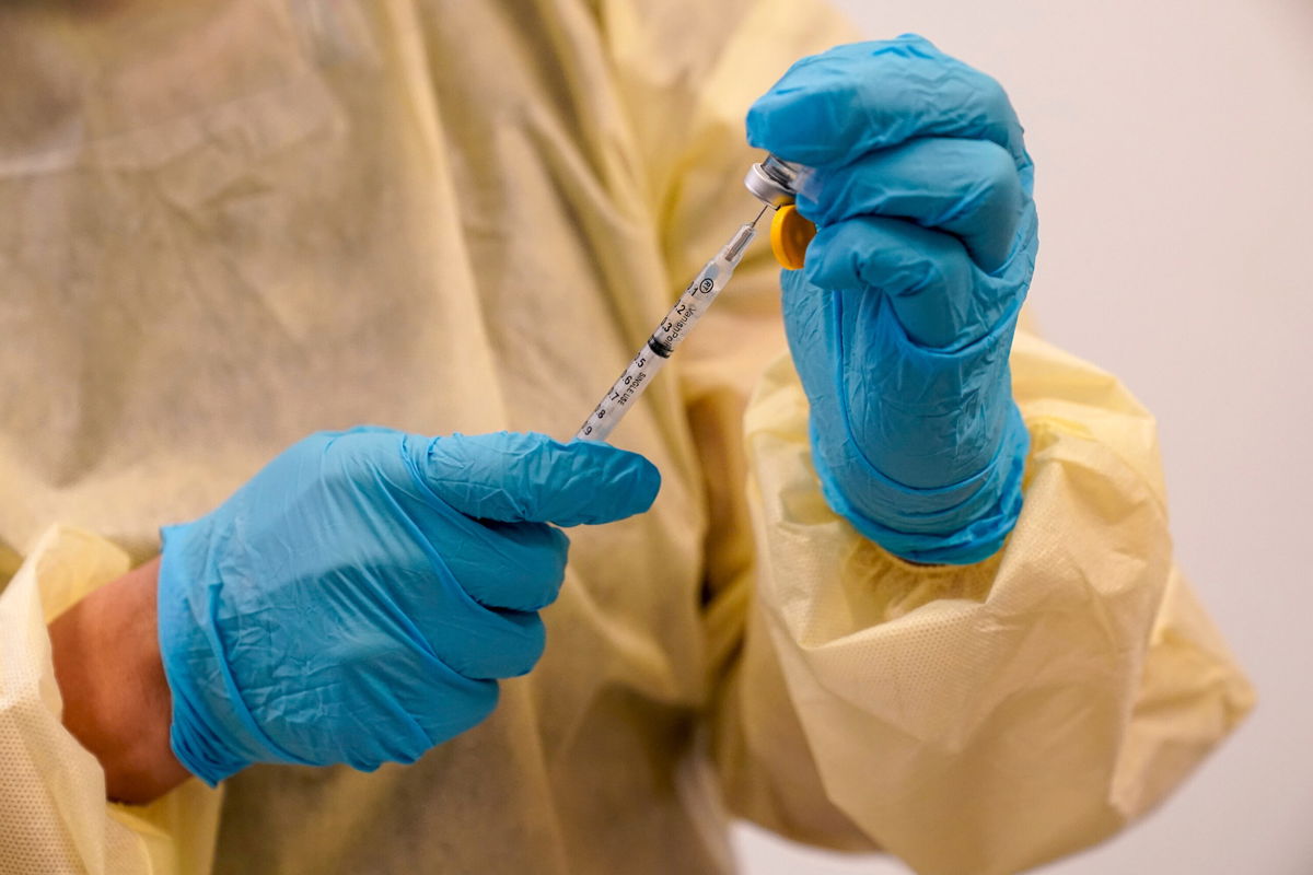 <i>Mary Altaffer/AP</i><br/>Physician Assistant Susan Eng-Na prepares a syringe with the monkeypox vaccine in New York on August 19. For the first time