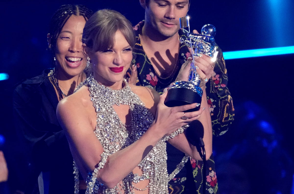<i>Charles Sykes/Invision/AP</i><br/>Taylor Swift accepts the award for best longform video for 