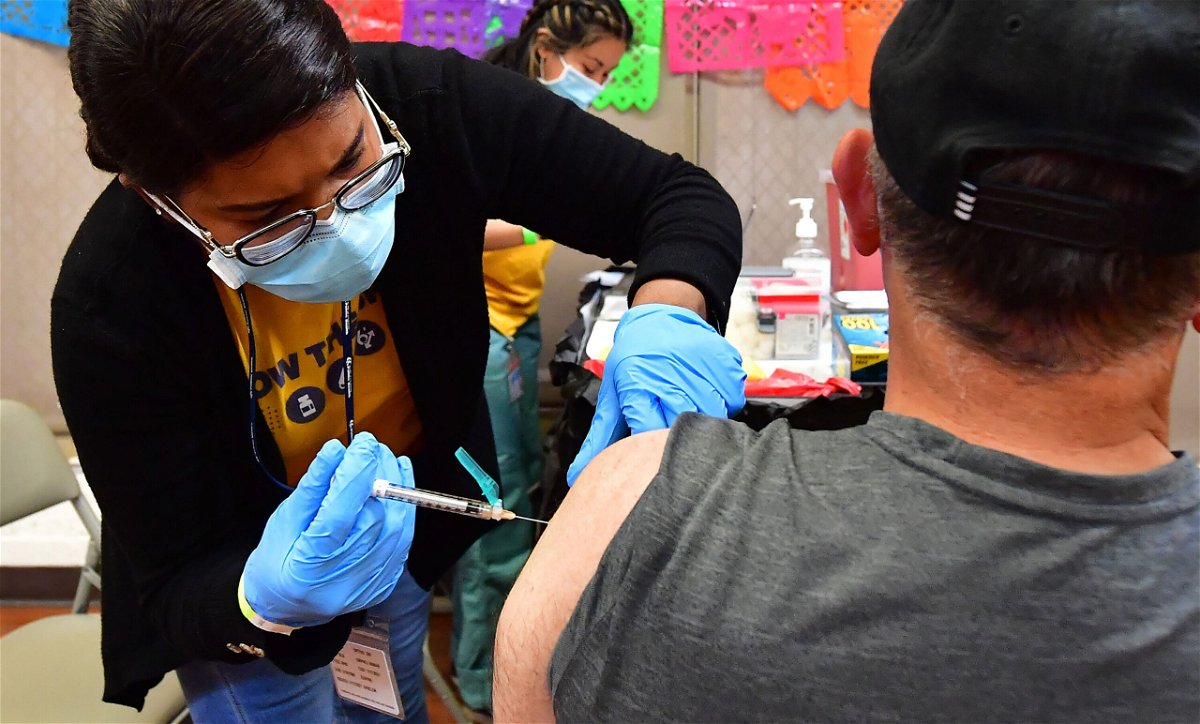 <i>Frederic J. Brown/AFP/Getty Images</i><br/>Pfizer and BioNTech seek FDA authorization for an updated Covid-19 booster. Pictured is a Covid-19 vaccination and testing site in Los Angeles on May 5.