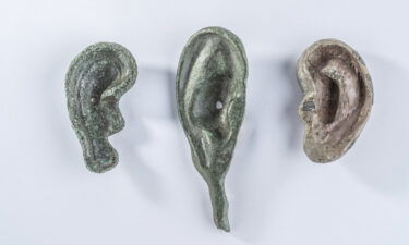 A collection of three ear-shaped votive offerings unearthed at San Casciano dei Bagni.