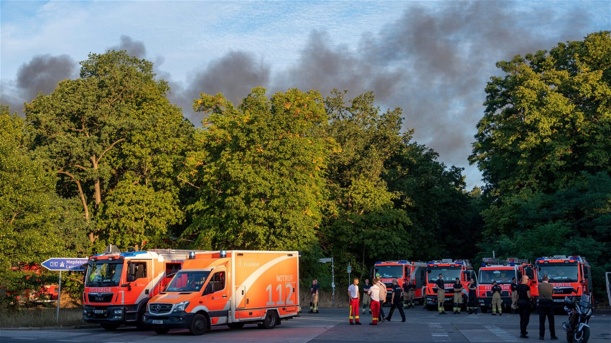 <i>Christophe Gateau/picture alliance via Getty Images</i><br/>A large fire broke out on August 4 in one of Berlin's biggest city forests -- the Grunewald -- following several explosions at a police-run munitions disposal site inside the forest. Fire engines are pictured here responding to the fire.