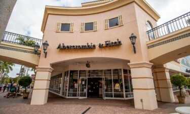 Shoppers walk past the facade of Abercrombie & Fitch Clothing Store in Miromar Outlets as the retailer that focuses on casual wear.