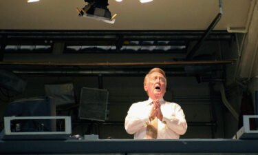 Vin Scully sings "Take Me Out to the Ball Game" during the seventh inning of a game between the Arizona Diamondbacks and the Los Angeles Dodgers in September 2011.