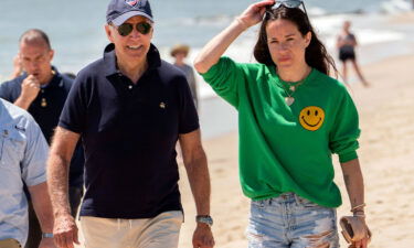 President Joe Biden walks on the beach with daughter Ashley Biden