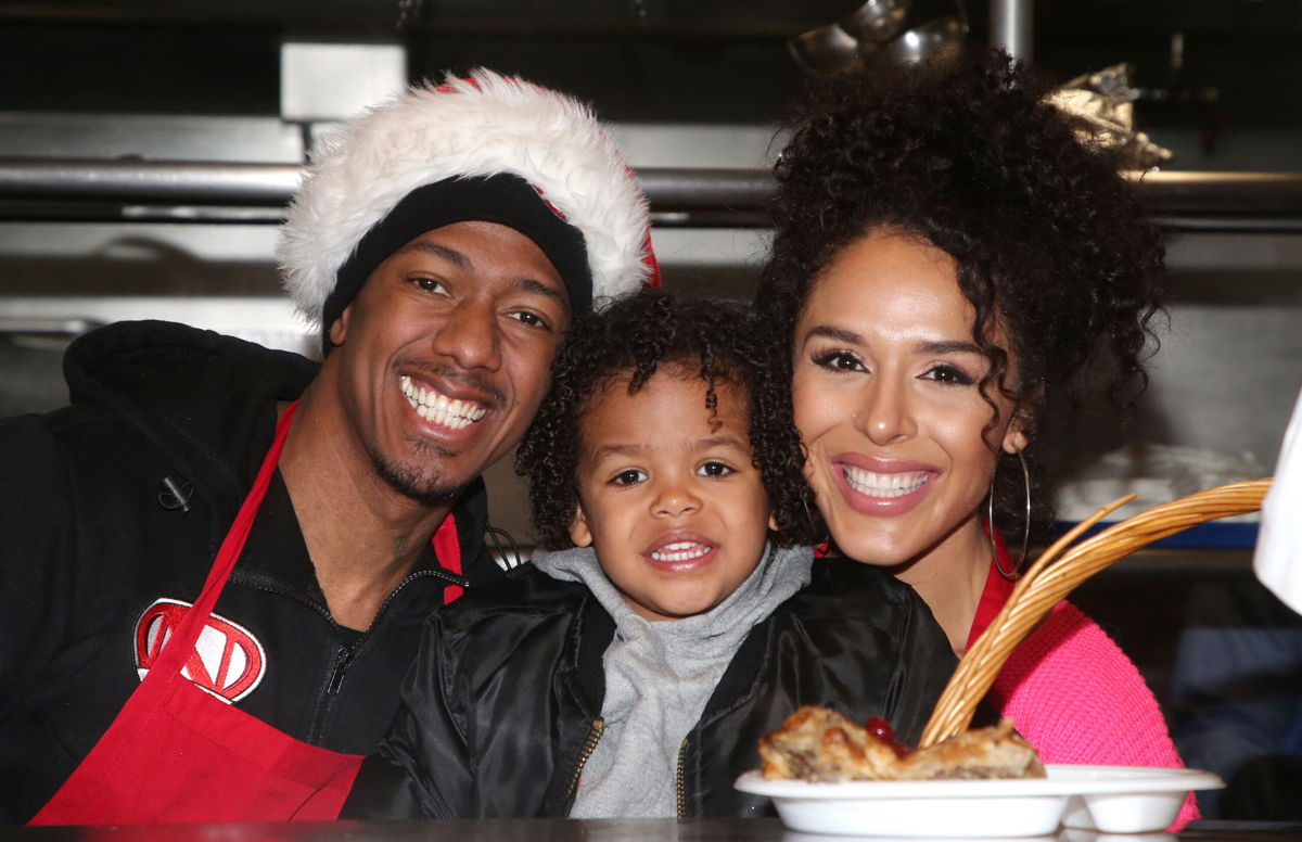 <i>MediaPunch/Shutterstock</i><br/>Nick Cannon and Brittany Bell with their child