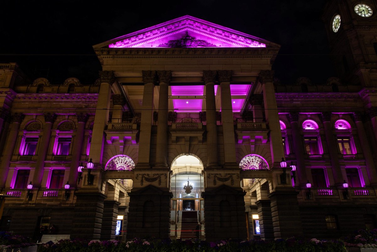 <i>Diego Fedele/AAP/Reuters</i><br/>Melbourne Town Hall turned pink on August 9 to honor Olivia Newton-John.