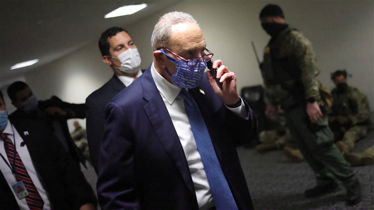 <i>Win McNamee/Getty Images</i><br/>Then Senate Minority Leader Chuck Schumer walks to a room on Capitol Hill where senators gathered on January 6