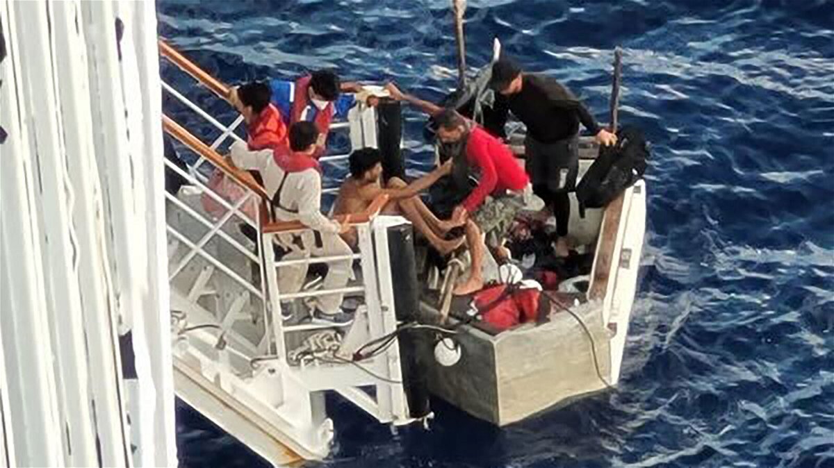 <i>Courtesy Cintia Zingoni</i><br/>A video captured Cuban migrants in a makeshift raft being rescued by a Carnival Cruise liner. The migrants are seen here boarding the Carnival Paradise cruise ship.