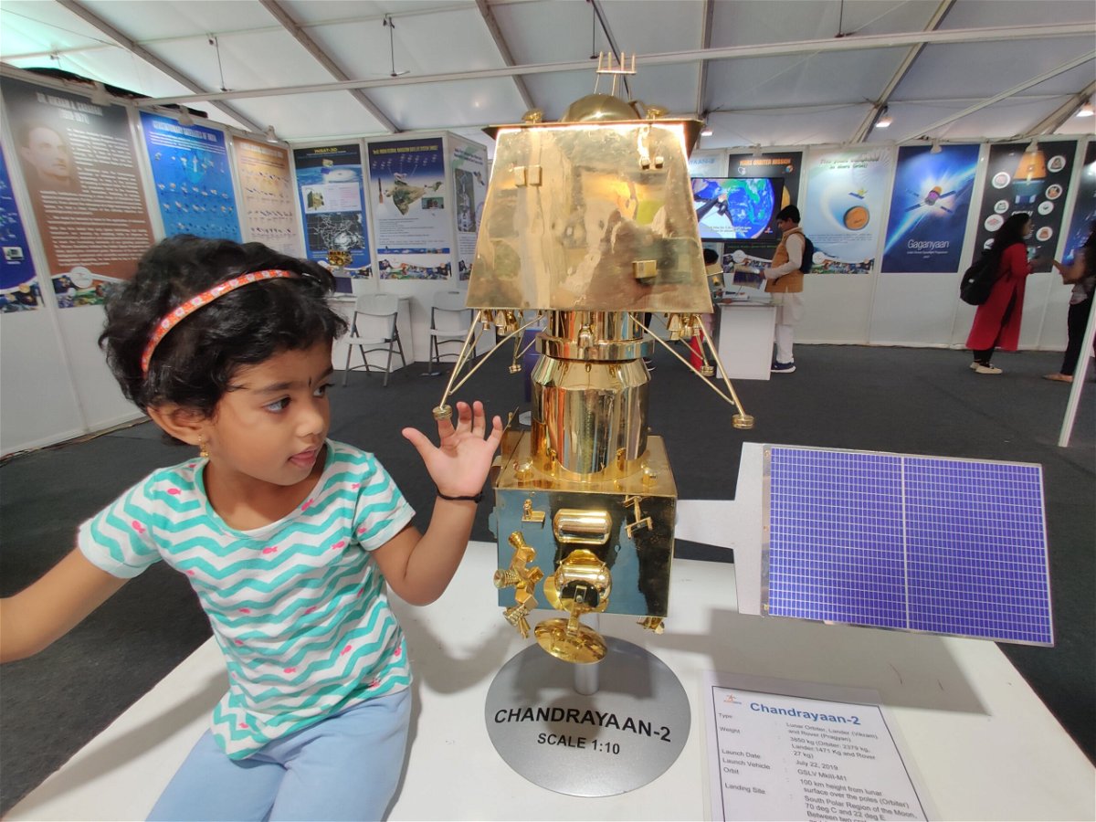 <i>Pallava Bagla/Corbis News/Getty Images</i><br/>A child touches a model of Indian mission to the moon.