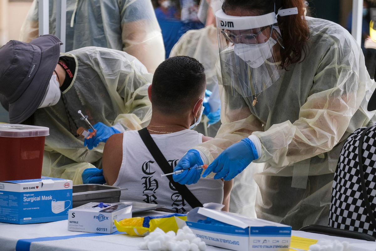 <i>Ringo Chiu/AP/FILE</i><br/>A healthcare worker is seen here preparing the monkeypox vaccine in Los Angeles in July. The US Department of Health and Human Services waited more than three weeks after the first confirmed case of monkeypox in the US to order bulk stocks of the vaccine in fear they may lose years of shelf life.